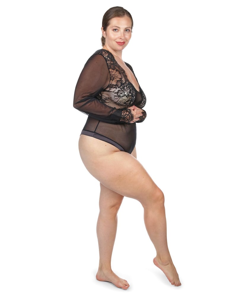 Side of a model wearing a size 1X Women's Josephine Long Sleeve Lace Mesh Bodysuit in Black by Memoi. | dia_product_style_image_id:299889